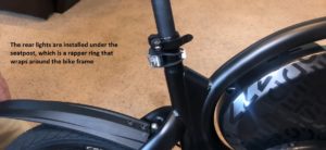 The rear lights are installed under the seatpost, which is a rapper ring that wraps around the bike frame