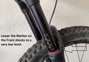 Lower the Marker on the Front shocks to a very low level.